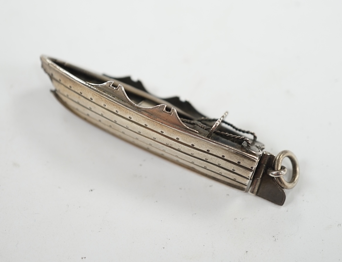 A Sampson Mordan and Co white metal novelty propelling pencil, modelled as a rowing boat, 60mm. Condition - poor. (oar missing)